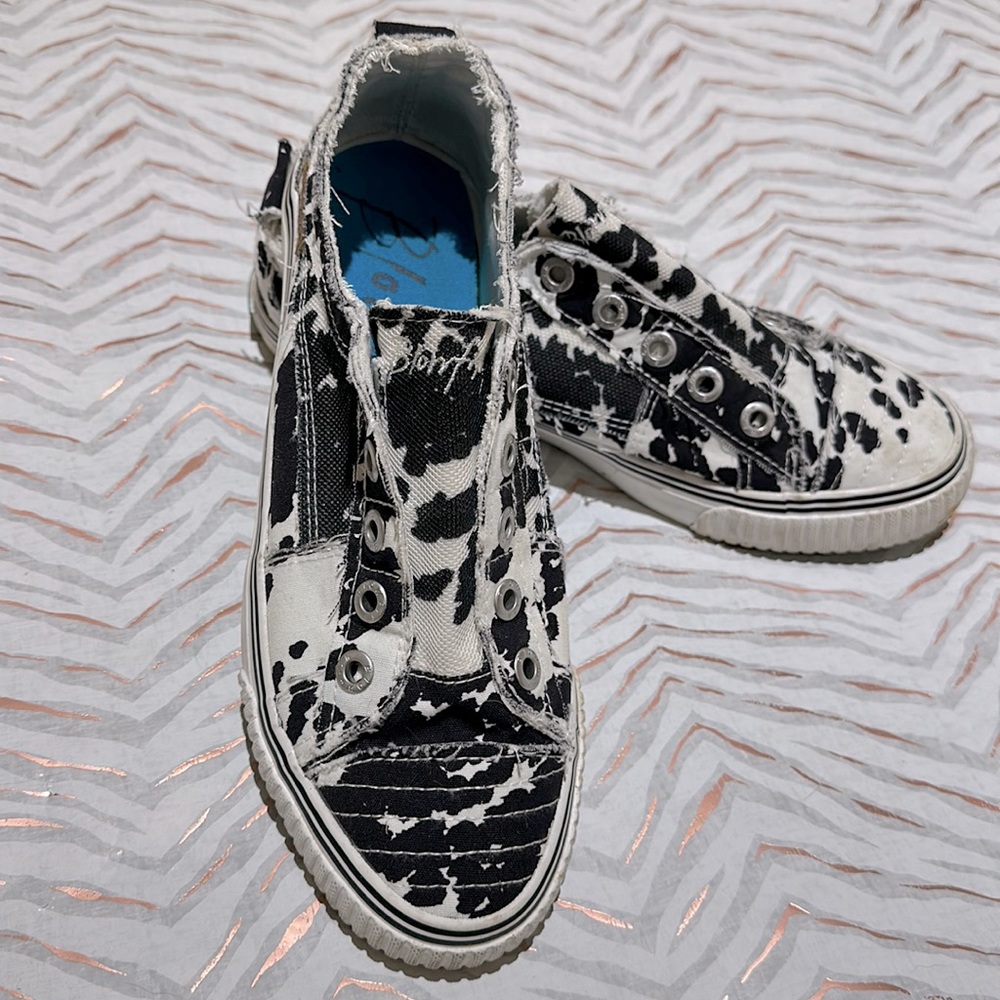 Blowfish comfy cowprint slip ons.